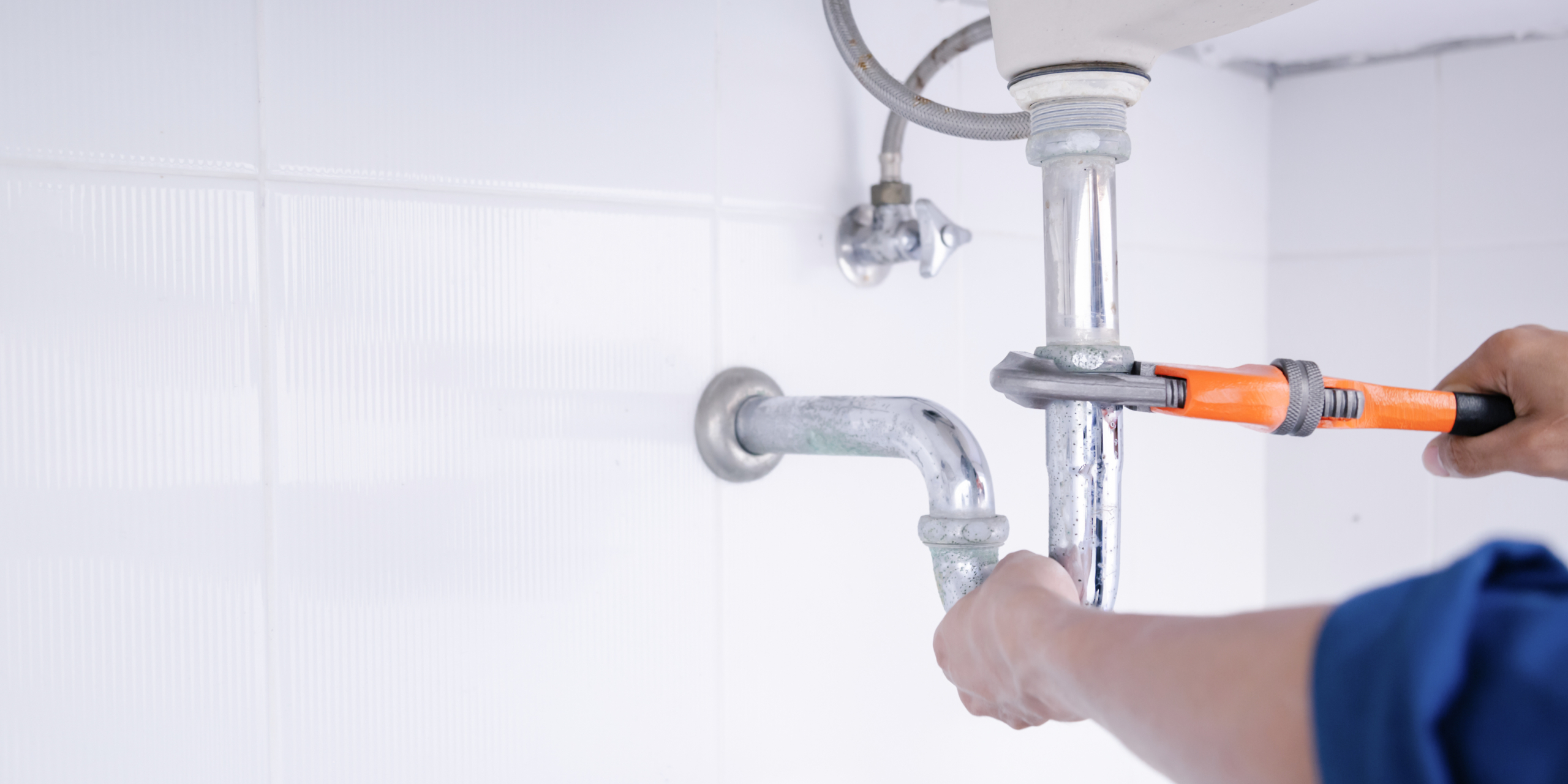 Plumber working in the bathroom, plumbing repair service, repair